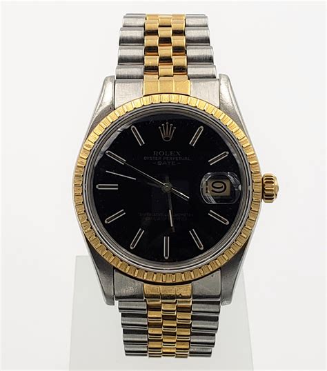 rolex oyster perpetual date black and gold